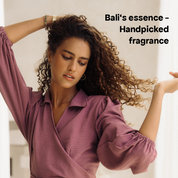 Abbildung einer Frau mit Schönem, Lockigem Haar, in Lavendel farbenem Kleid und der Aufschrift: "Bali's essence - Handpicked fragrance" in der rechten oberen ecke