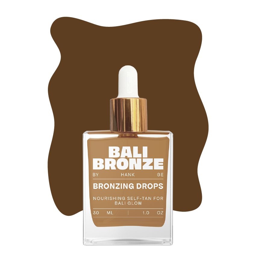 Bali Bronze Bronzing Drops Produktabbildung vor braunem, leicht welligem Rechteck auf transparentem Hintergrund