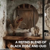 Abbildung von Holz Badezimmer Theke mit Bali Home Black Rose auf der Ablage und der Aufschrift: "A refined Blend of Black Rose and Oud"
